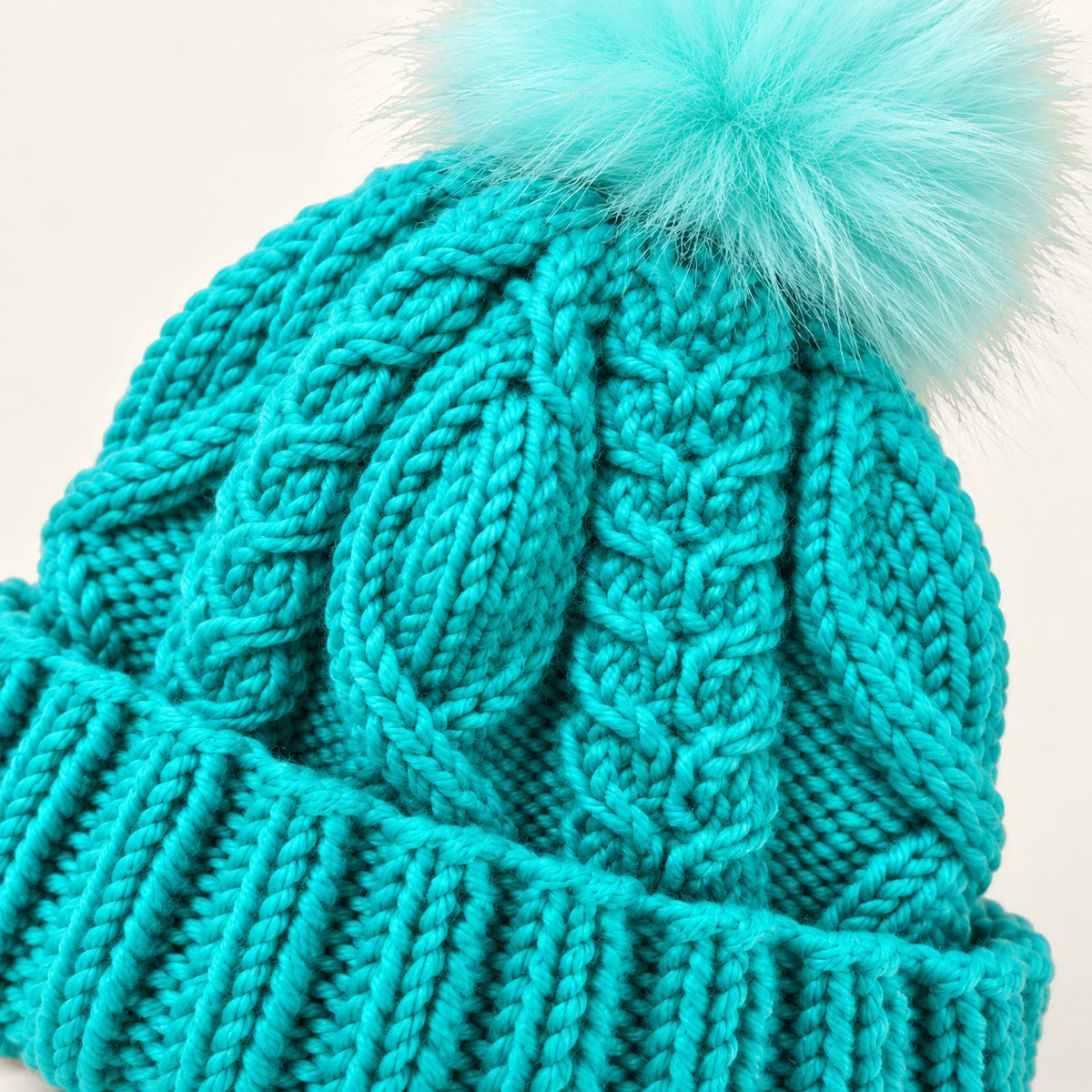 Turquoise Cable-knit Hat, Pattern and pom-pom detail